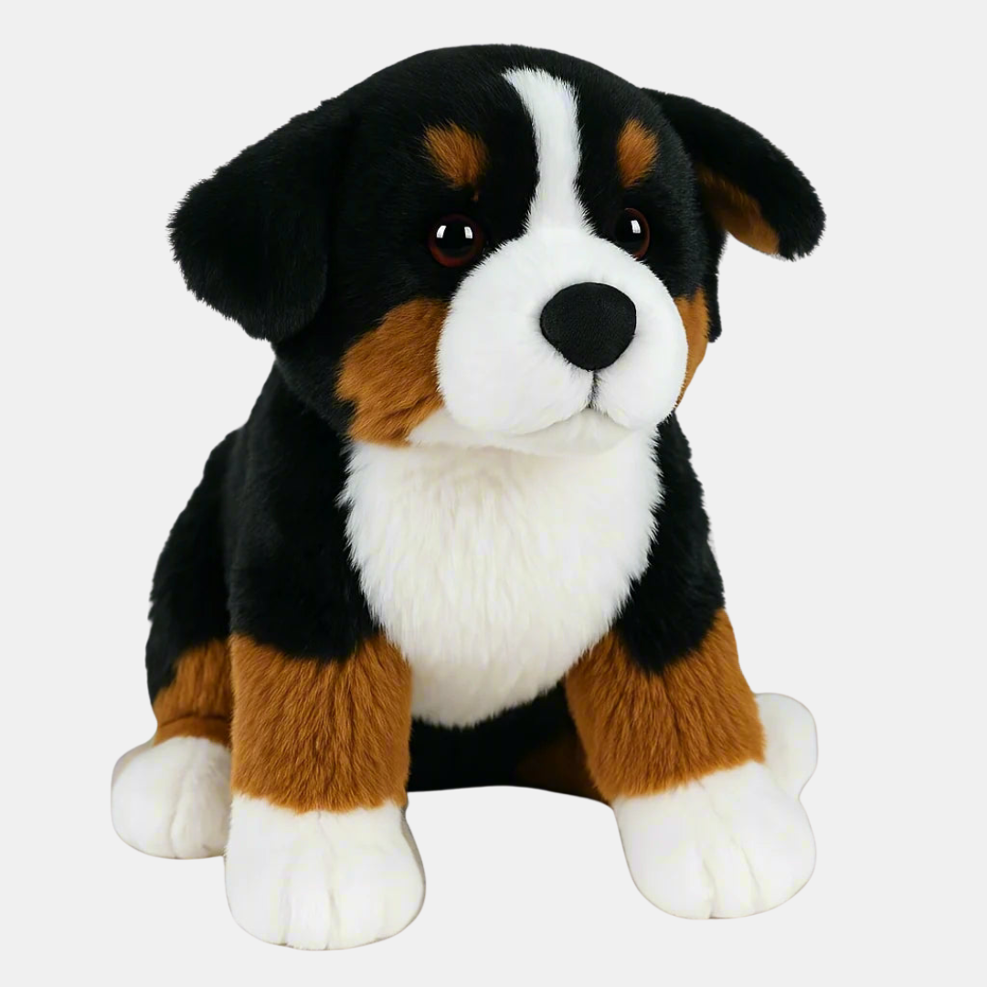Plush toy dog with black, brown, and white fur on a white background
